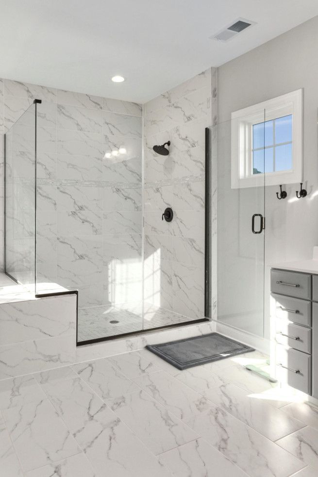 Beautiful marble tiled bathroom interior in Swansea.
